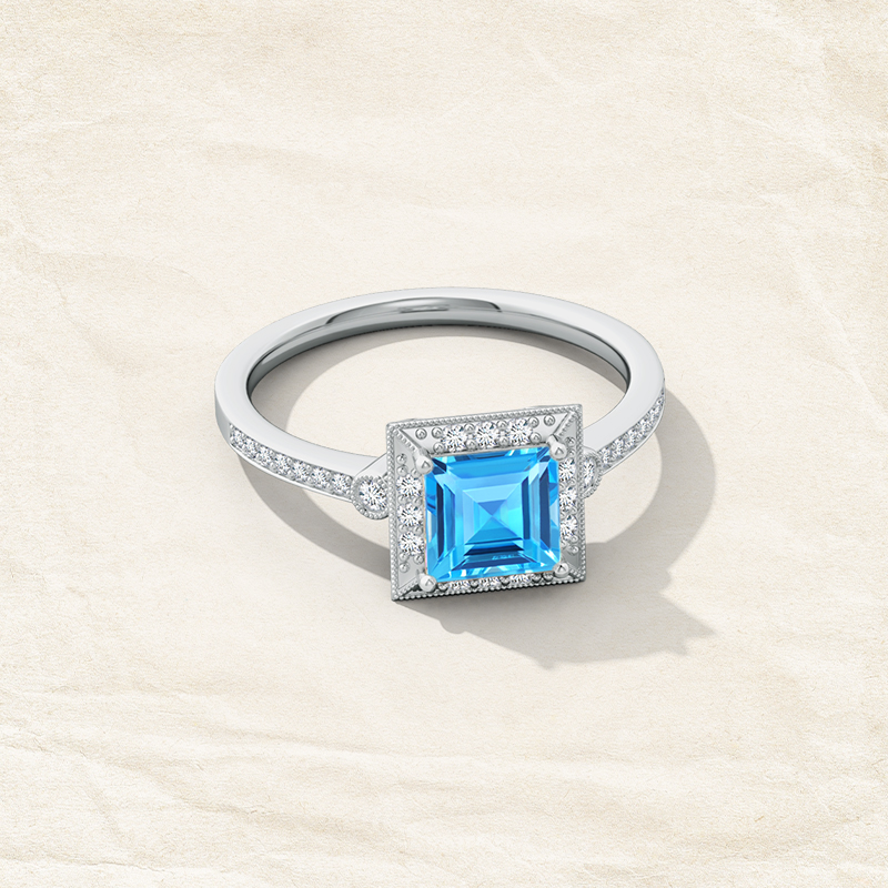 Vintage Inspired Jewelry that You Must Own! milgrain-edged-square-swiss-blue-topaz-and-diamond-halo-ring